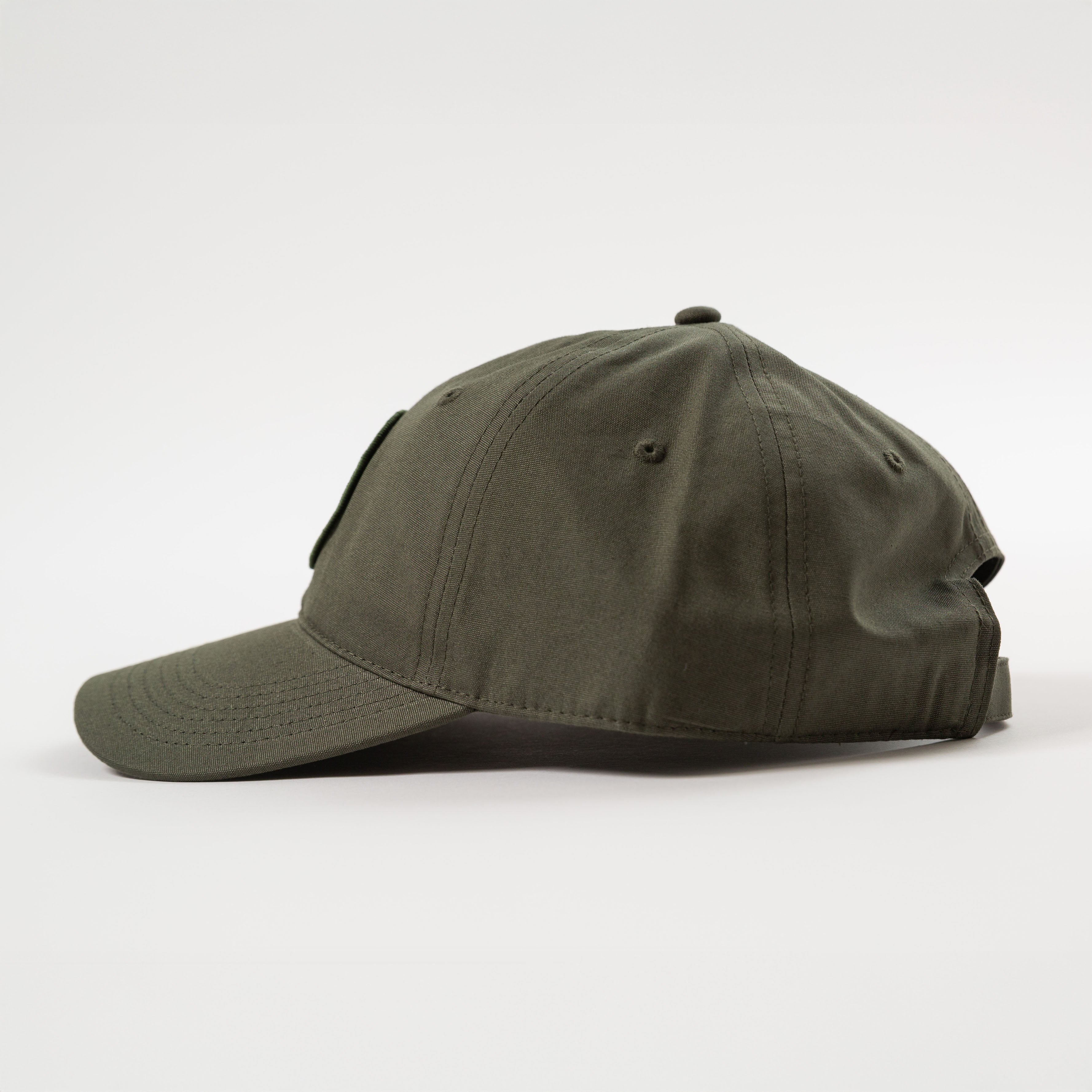 Green baseball cap on a white background