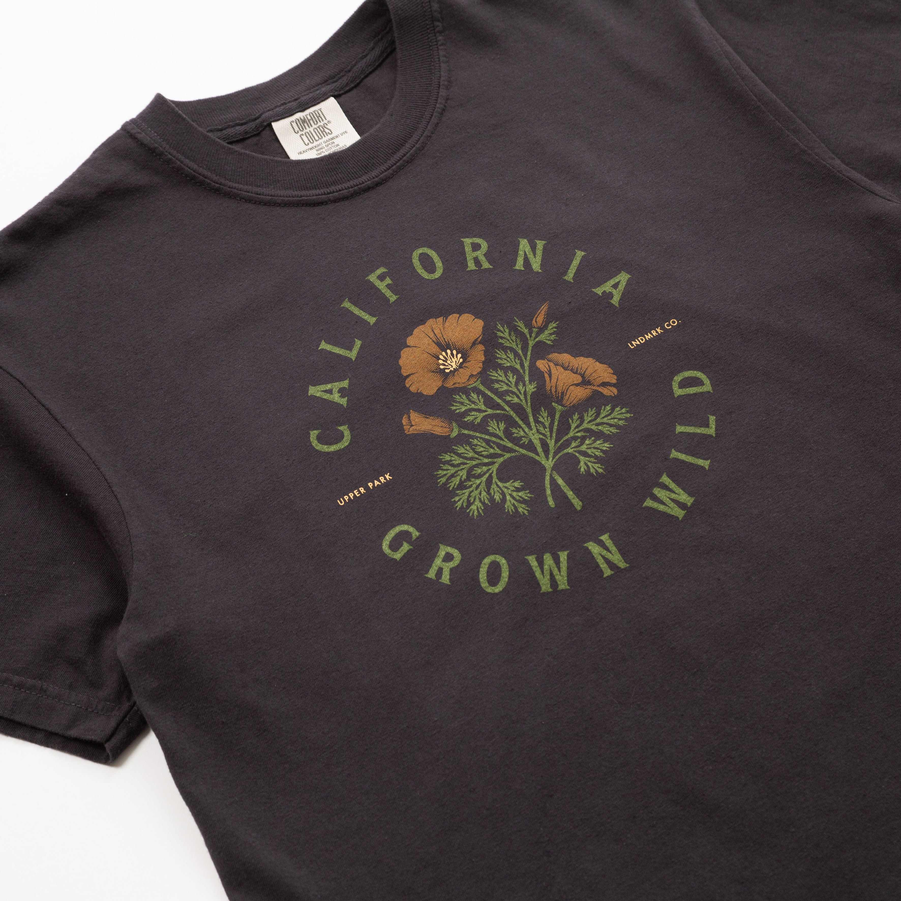 Black t-shirt with 'California Grown Wild' graphic on a white background