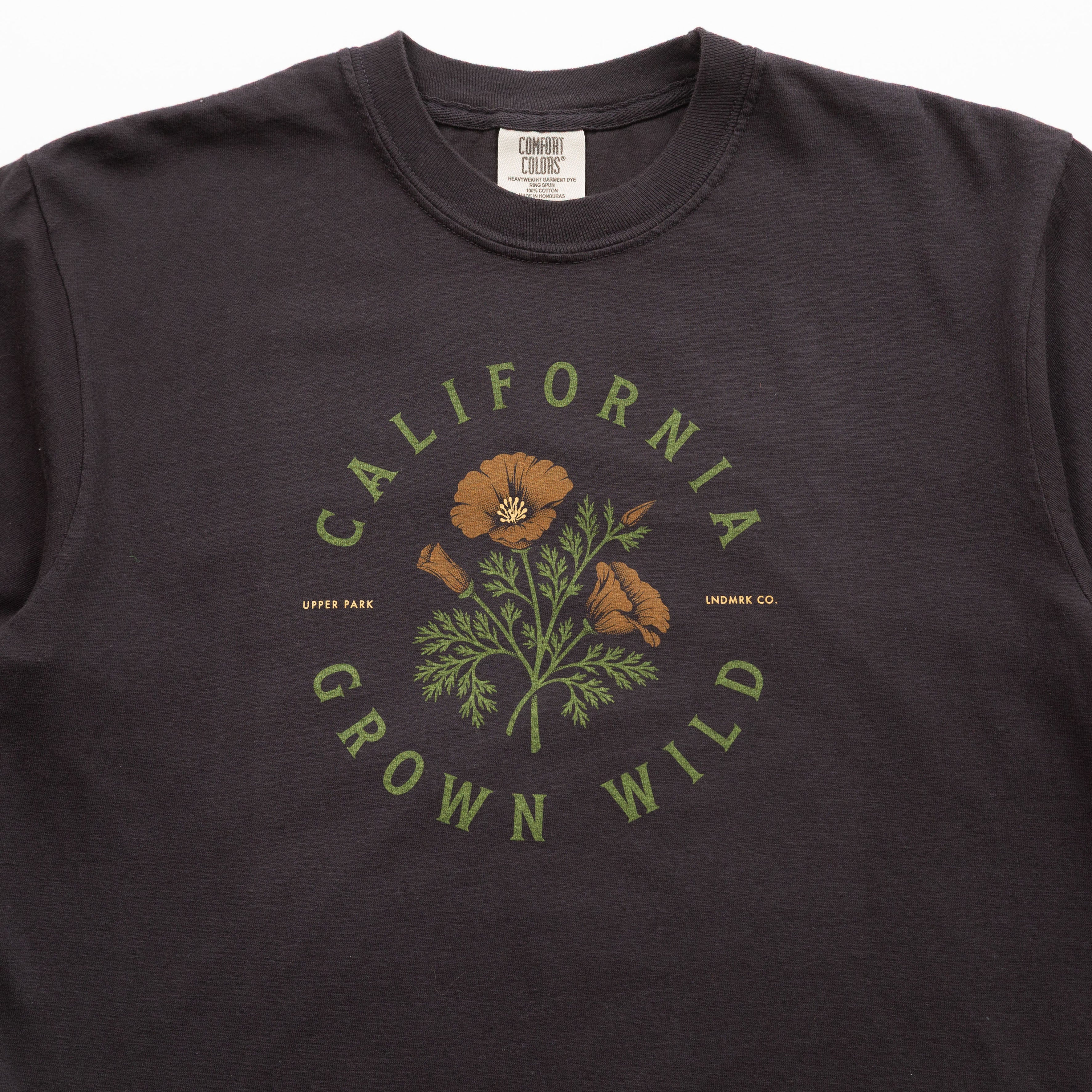 Black t-shirt with 'California Grown Wild' graphic design on a plain background