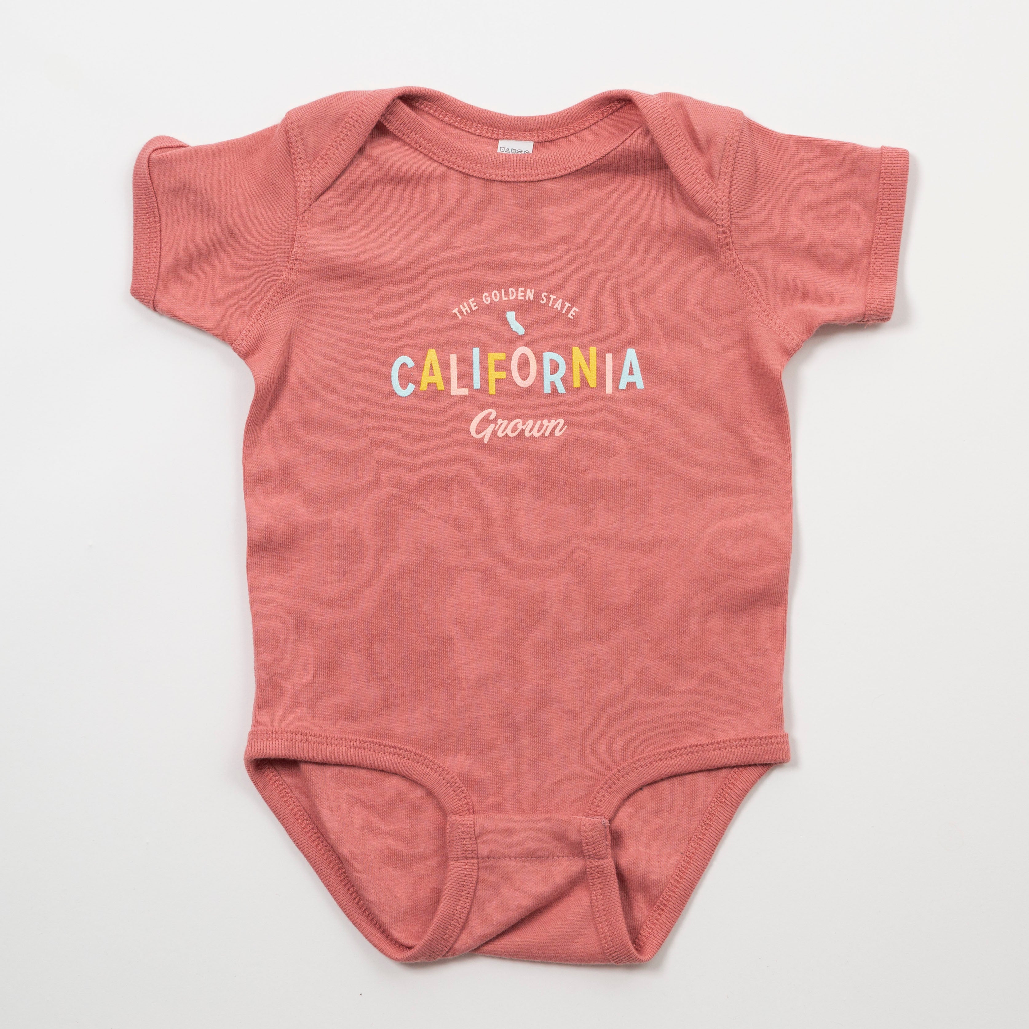 Pink baby onesie with 'California Grown' text on a white background - Upper Park Baby Onesie California Collection