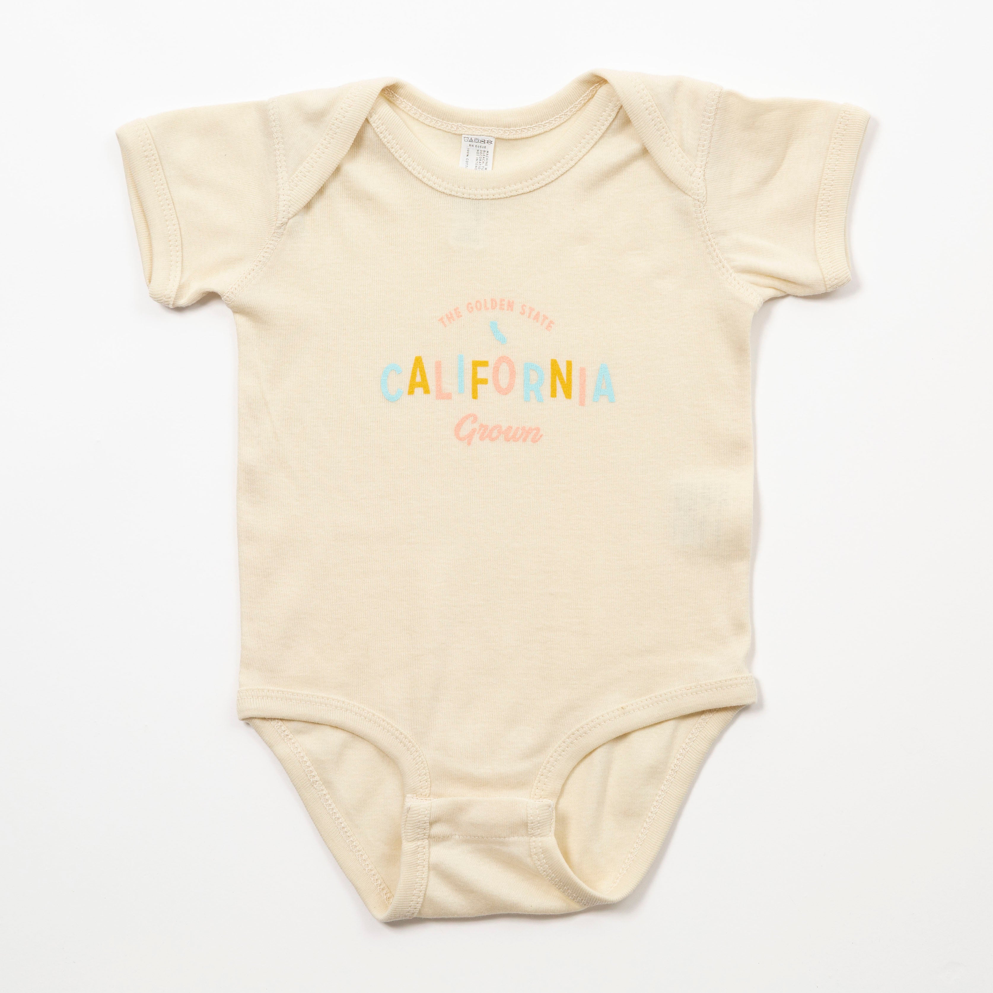 Beige baby onesie with 'California Grown' text on a white background - Upper Park Baby Onesie California Collection