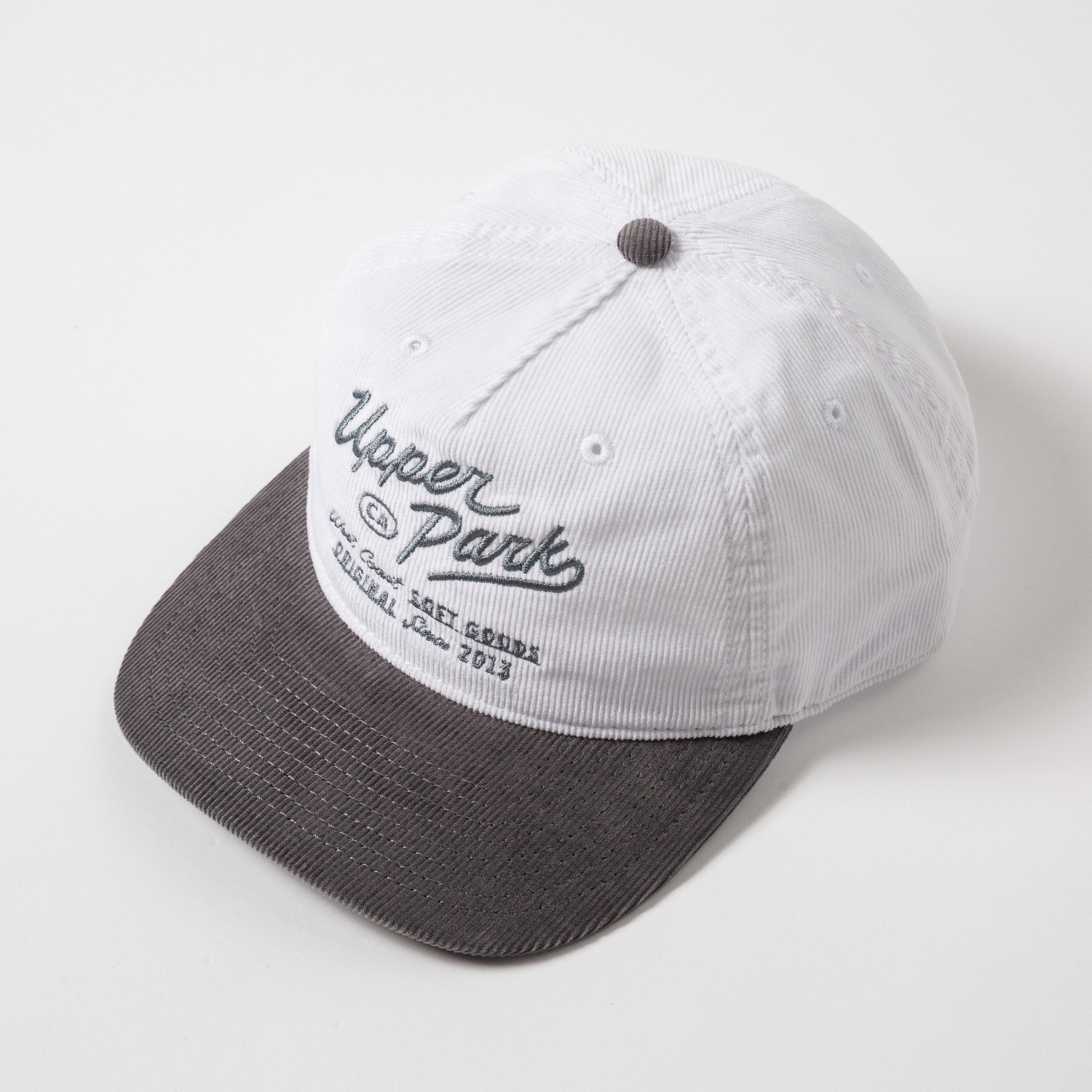 Menlo Embroidered Corduroy Hat - White and gray cap with 'Upper Park' branding on a white background