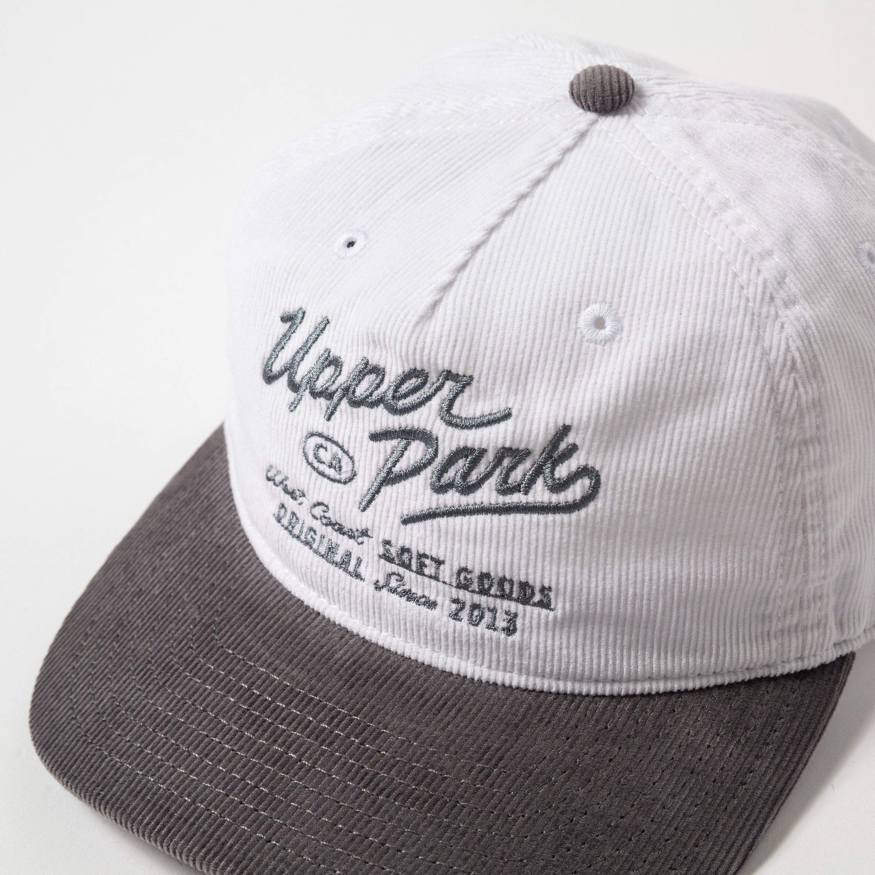 Menlo Embroidered Corduroy Hat - White and gray cap with 'Upper Park' branding on a white background