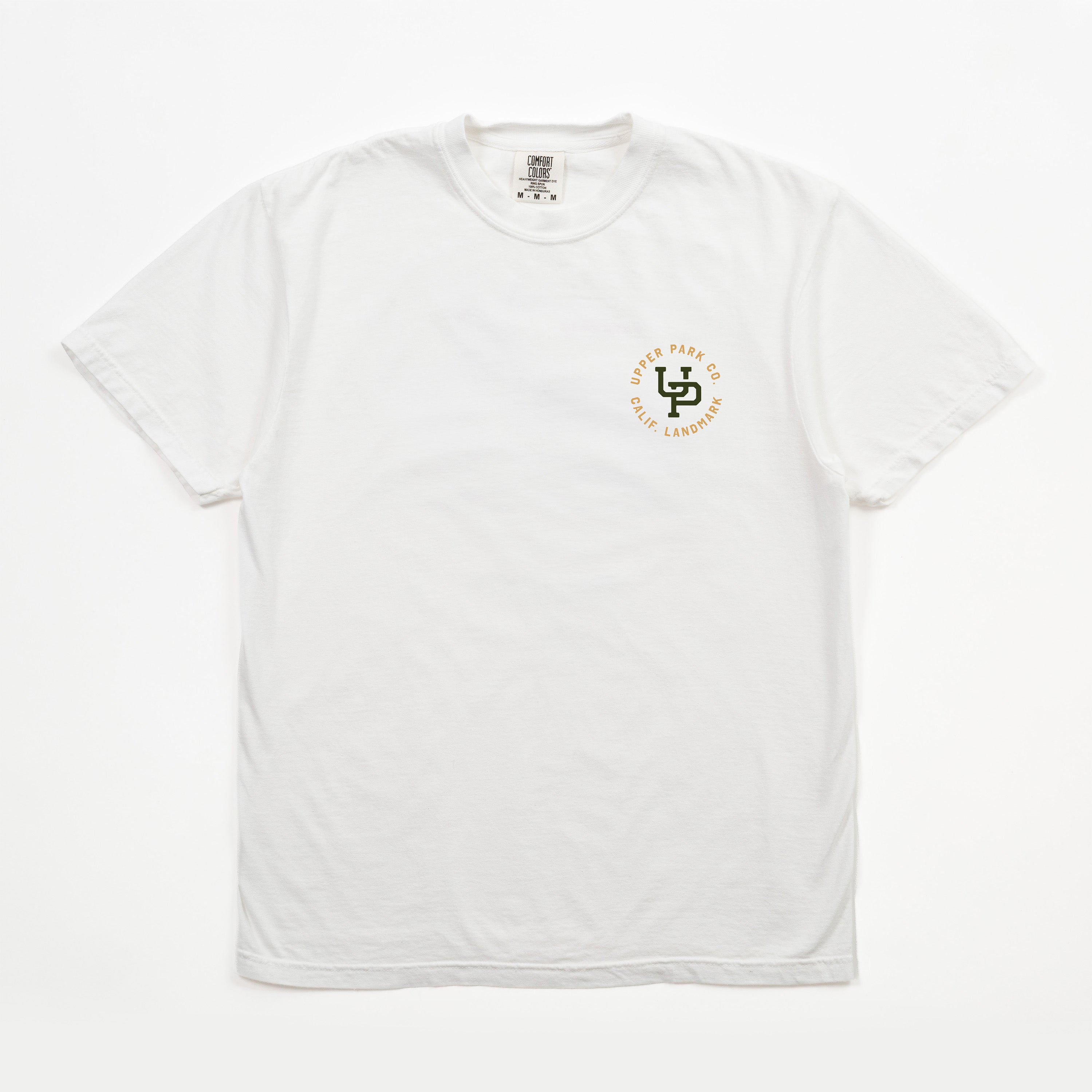 A white short-sleeve crewneck t-shirt with a small circular chest graphic on the left side. The graphic features a green stylized 'LS' monogram with the words 'LIFE IS SHORT' and 'MAKE IT LONG' in orange around it.