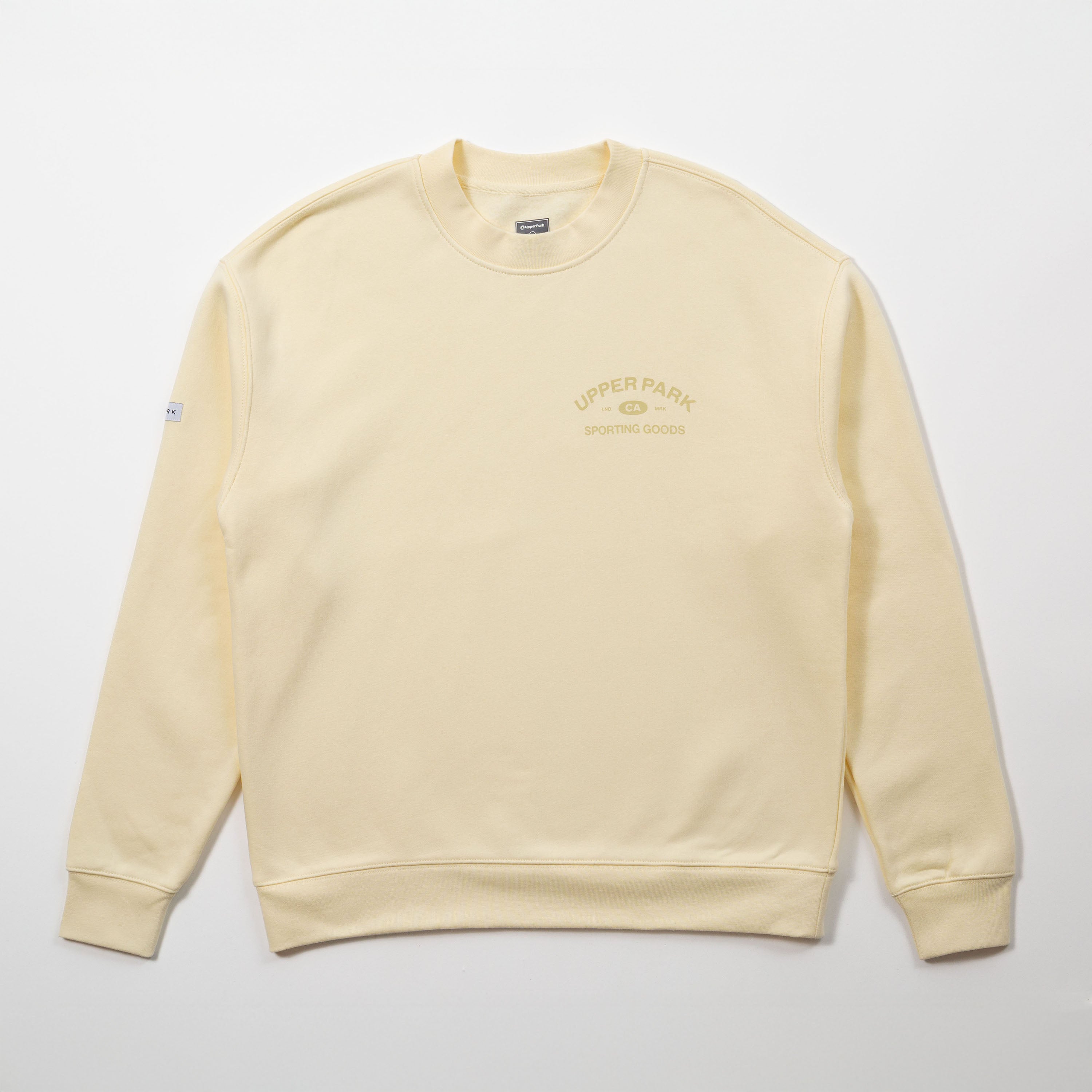Yellow sweatshirt with branding on a light gray background - Upper Park Athletics Sweater Set