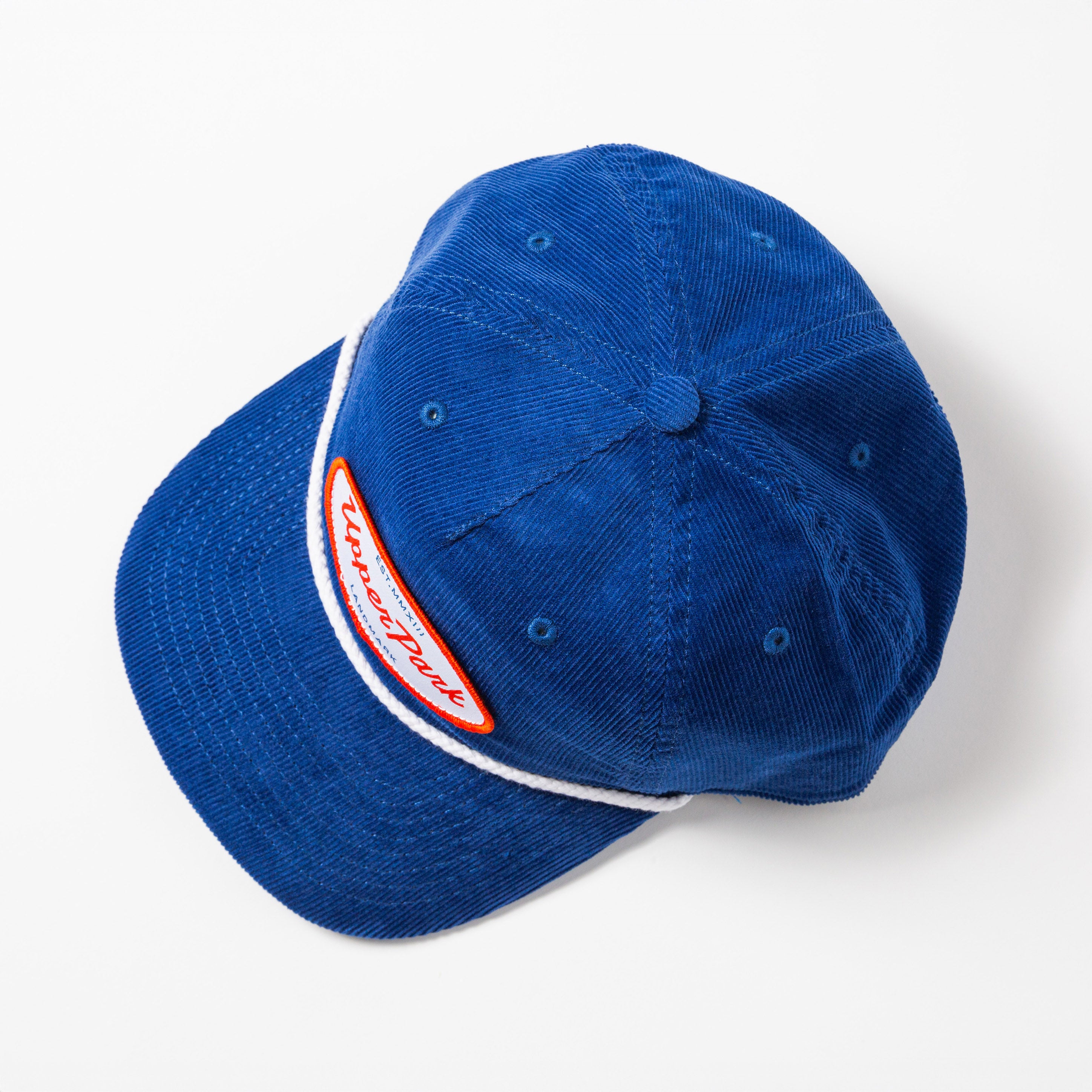 Blue cap with a white and red strap on a white background - Values Corduroy Rope Hat