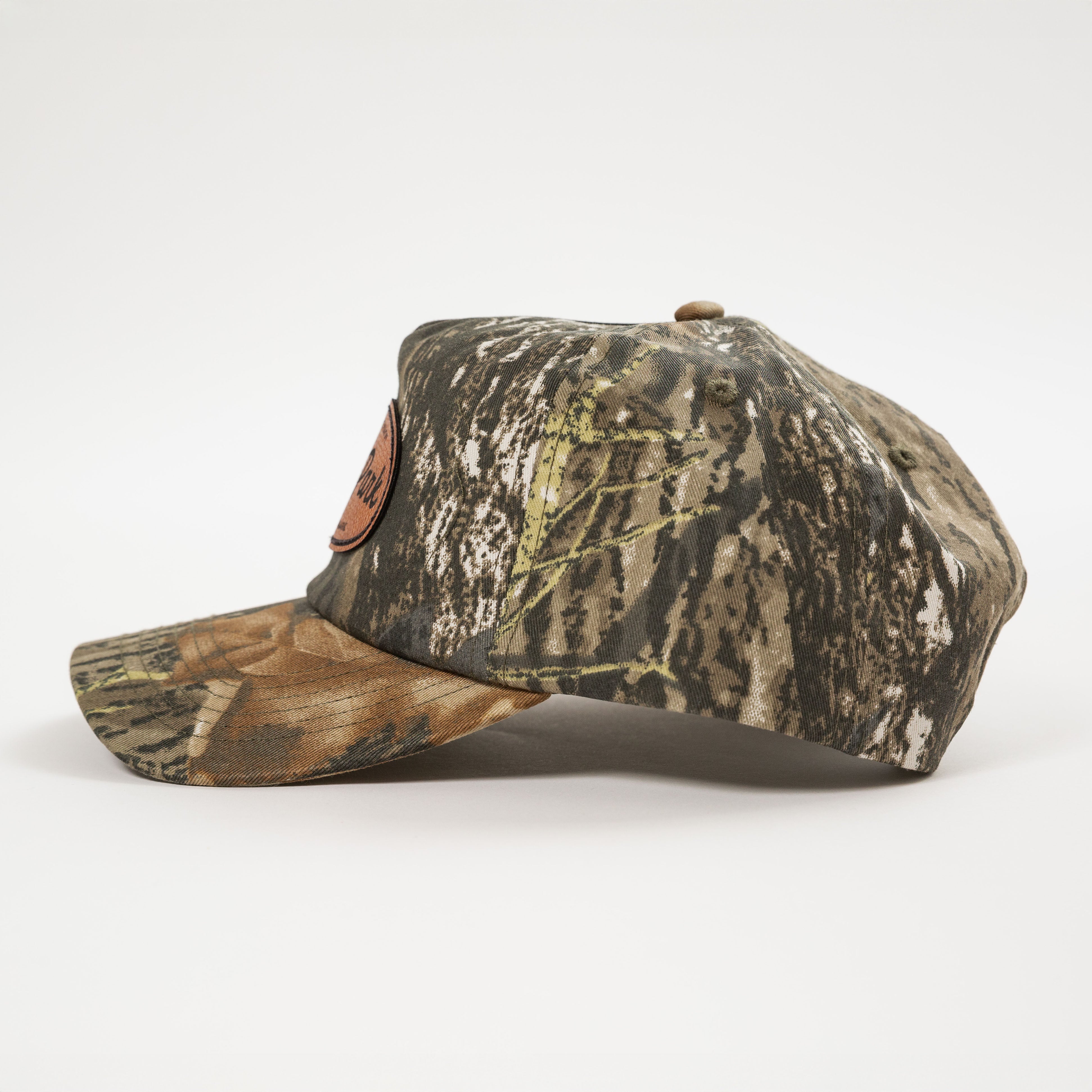 Camouflage-patterned baseball cap on a white background