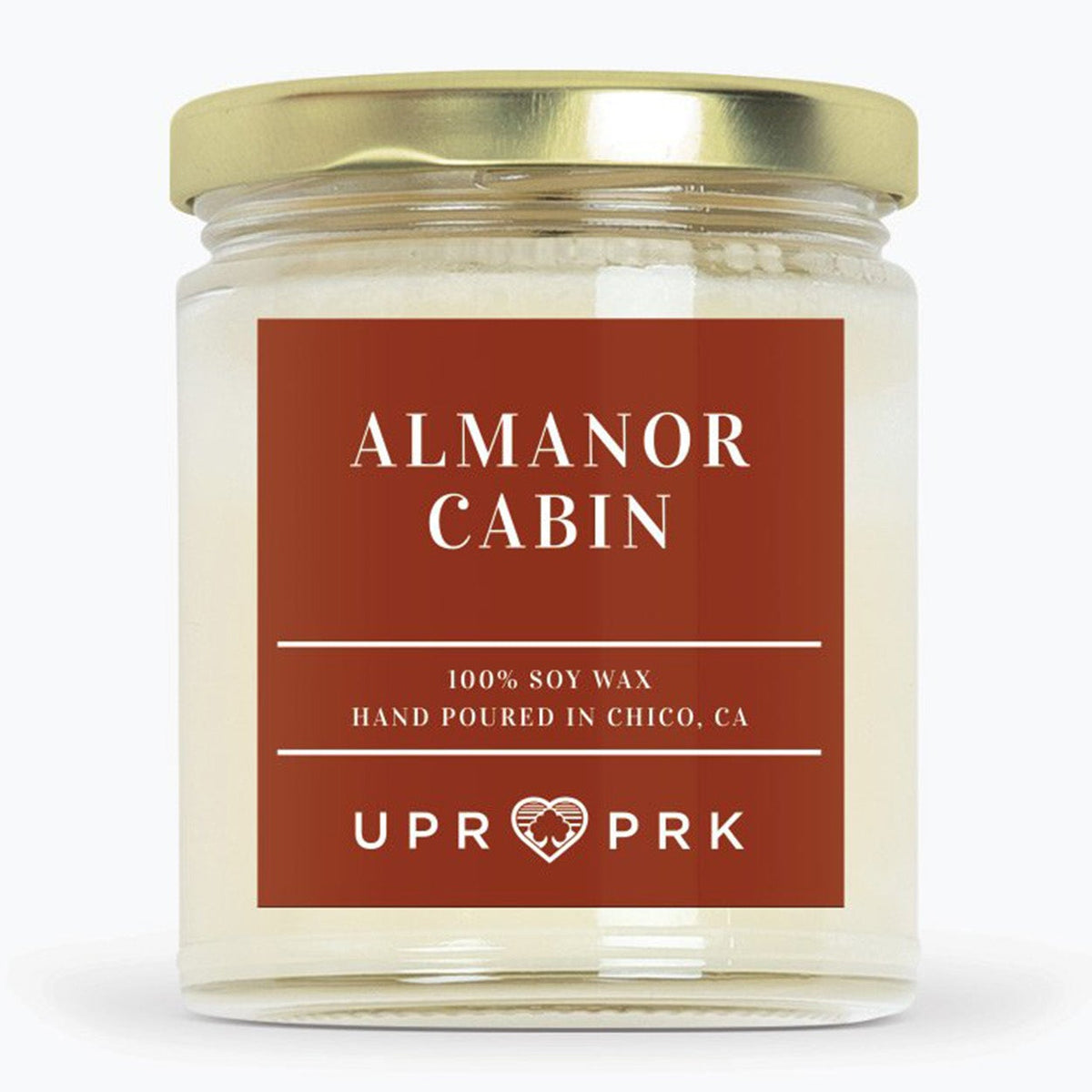 Almanor cabin candle on white background