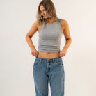 Woman wearing a gray tank top and blue jeans on a white background - Women's Basics - Baby Rib Tank Top