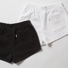 Basics Women's Heavy Fleece Cotton Shorts - Black and white shorts on a light gray background