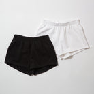 Basics Women's Heavy Fleece Cotton Shorts - Black and white shorts on a light gray background