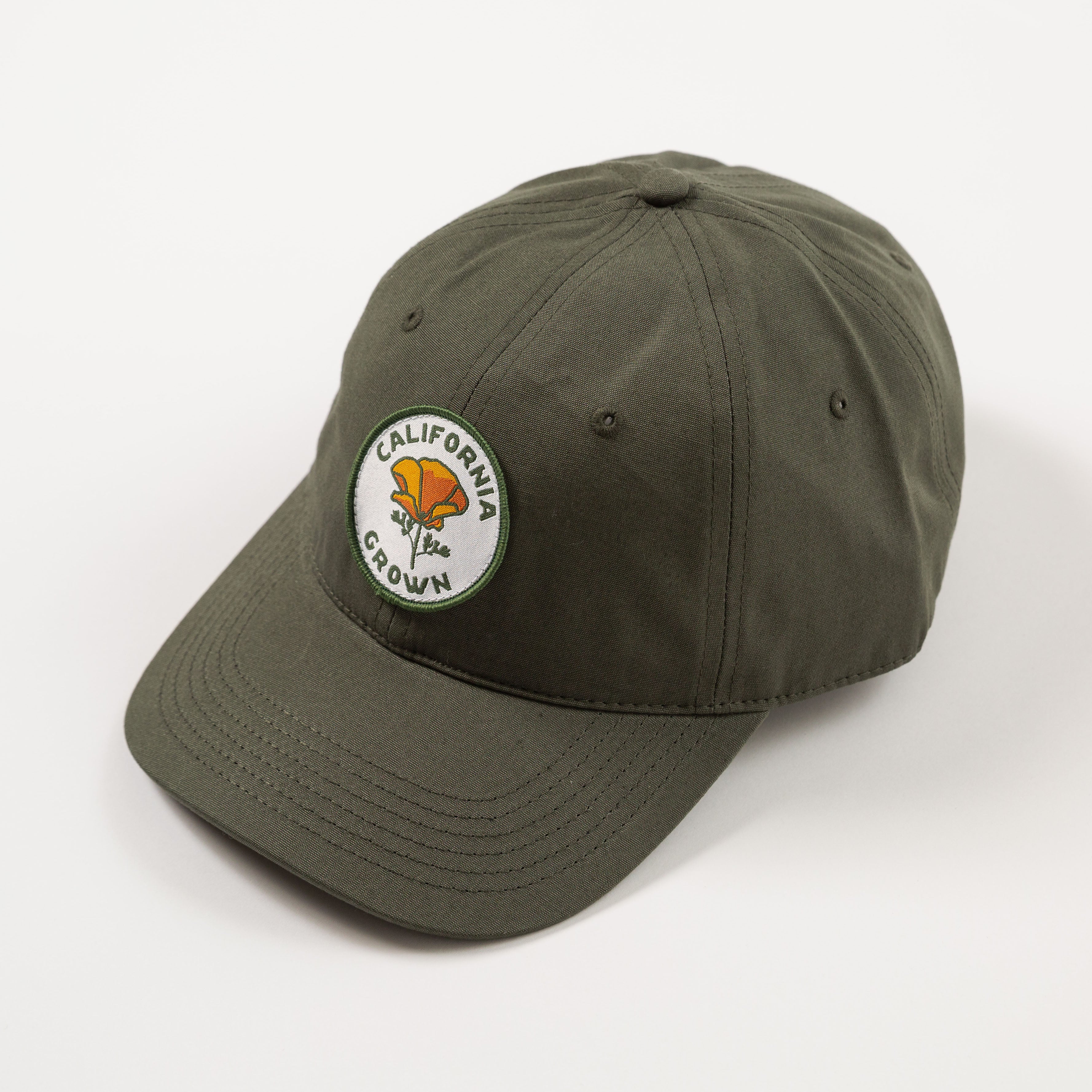 Green cap with a California Grown logo on a white background