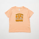 Peach-colored t-shirt with 'California Grown' text and floral design on a light gray background