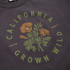 Dark gray sweatshirt with 'California Grown Wild' graphic and floral design.