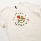 White t-shirt with 'California Grown Wild' graphic on a white background