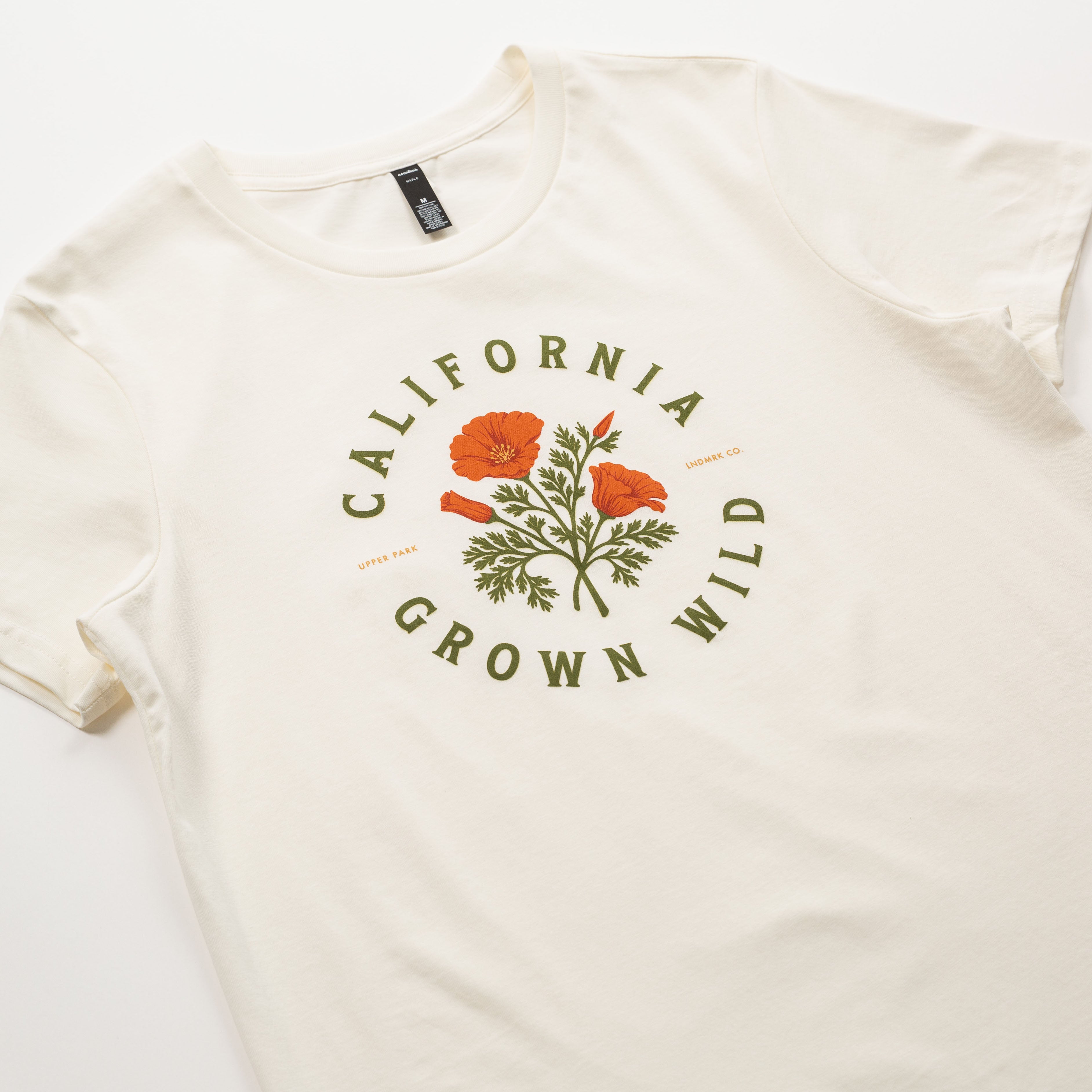 White t-shirt with 'California Grown Wild' graphic on a white background