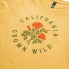 Yellow t-shirt with California poppy design and 'California Grown Wild' text on a plain background