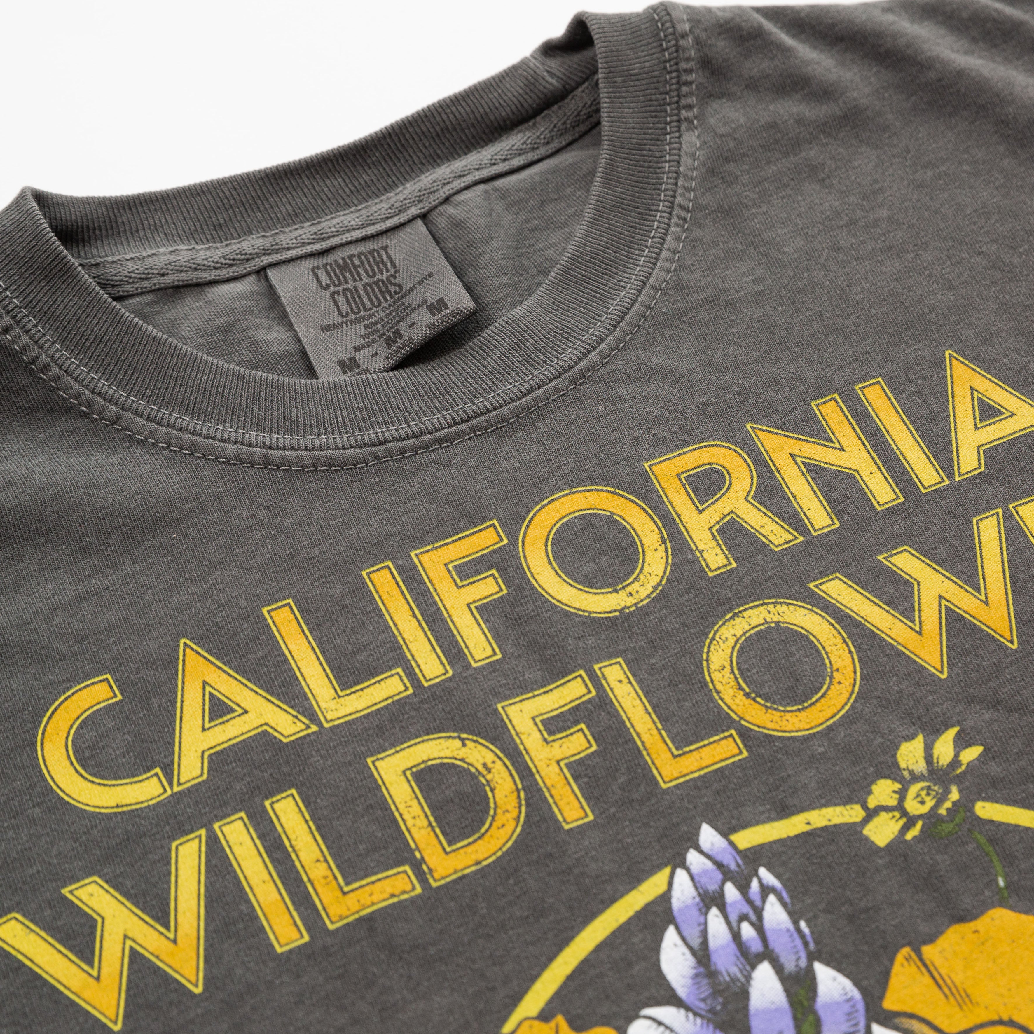 Gray t-shirt with yellow 'California Wildflowers' text and floral design  - Upper Park California Collection