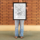 Woman holding a Chico Map Minimal Poster Print from Upper Park Clothing in Chico, Ca