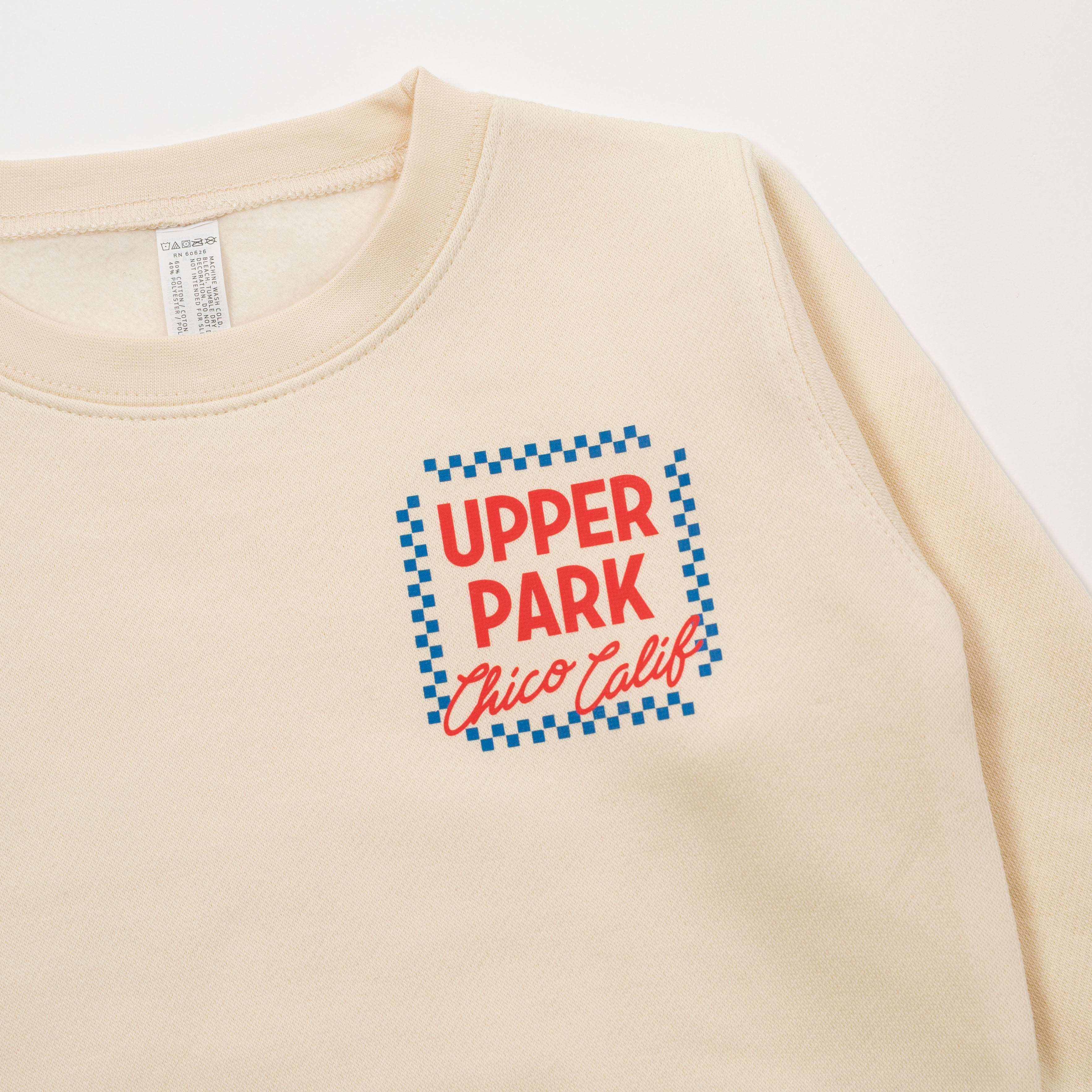 Beige sweatshirt with 'Upper Park Chico Calif' text on a white background - Upper Park Clothing Toddler Crewneck Sweatshirt