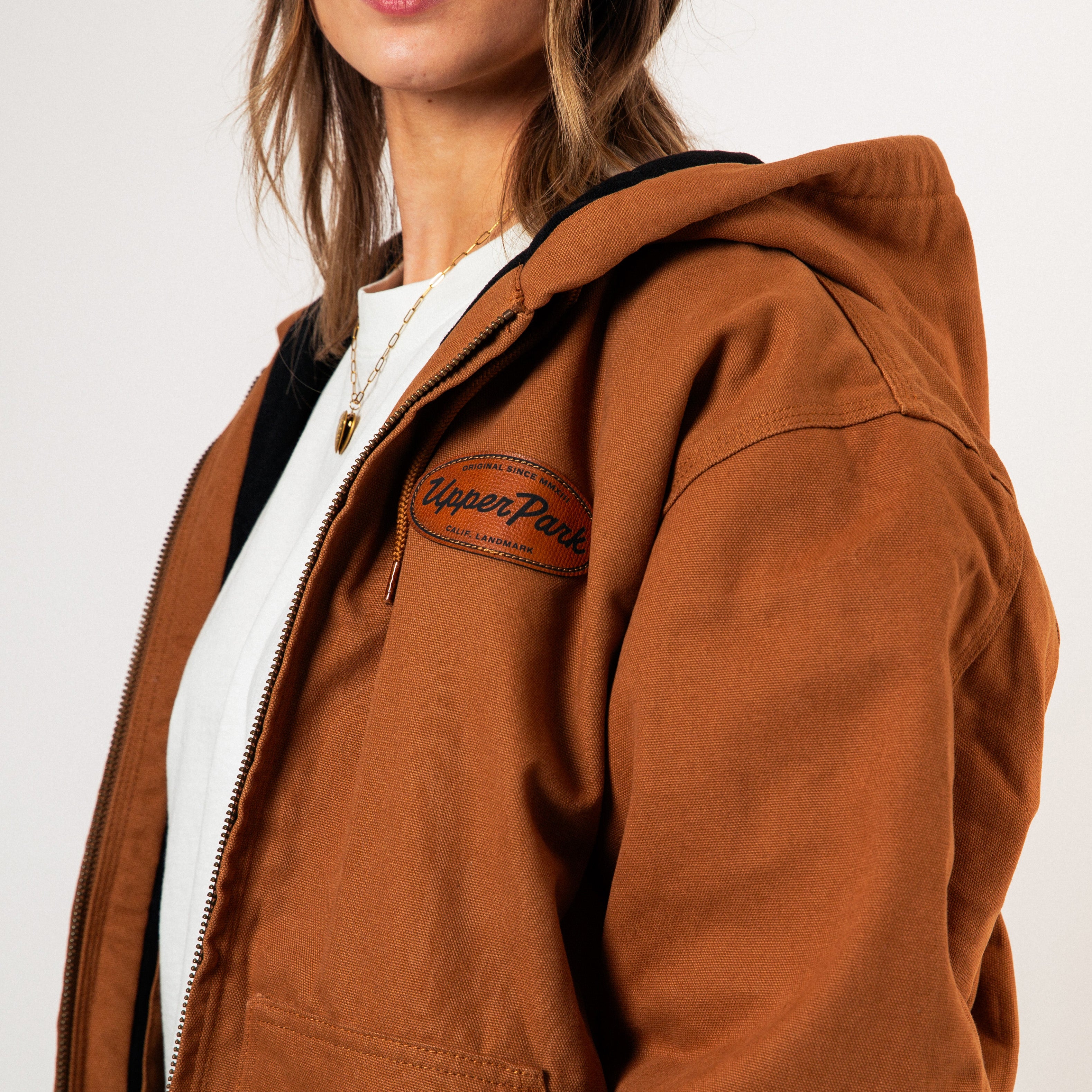 Brown jacket with a brand logo on a white background - Cultivators Upper Park Duck Canvas Jacket