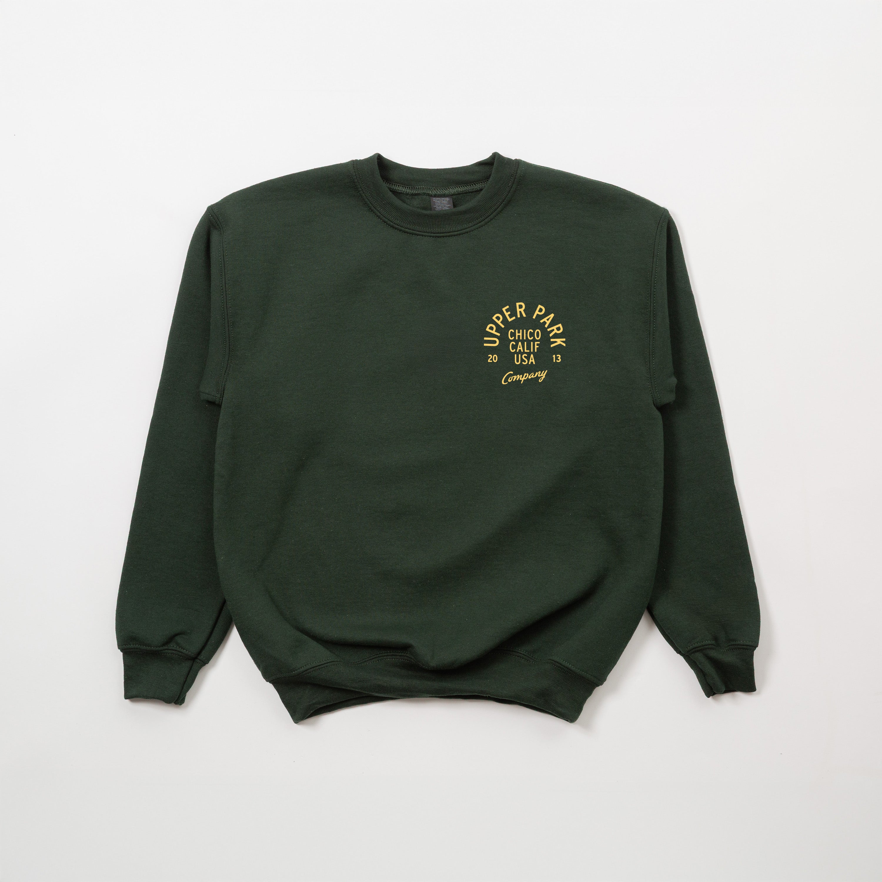 Green sweatshirt with yellow Upper Park text on a light gray background