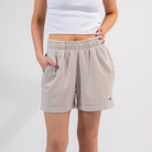 Beige shorts worn by a person on a white background - Upper Park Basics - Garment Dyed Relax Shorts