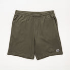 Olive green shorts with a small logo on a white background