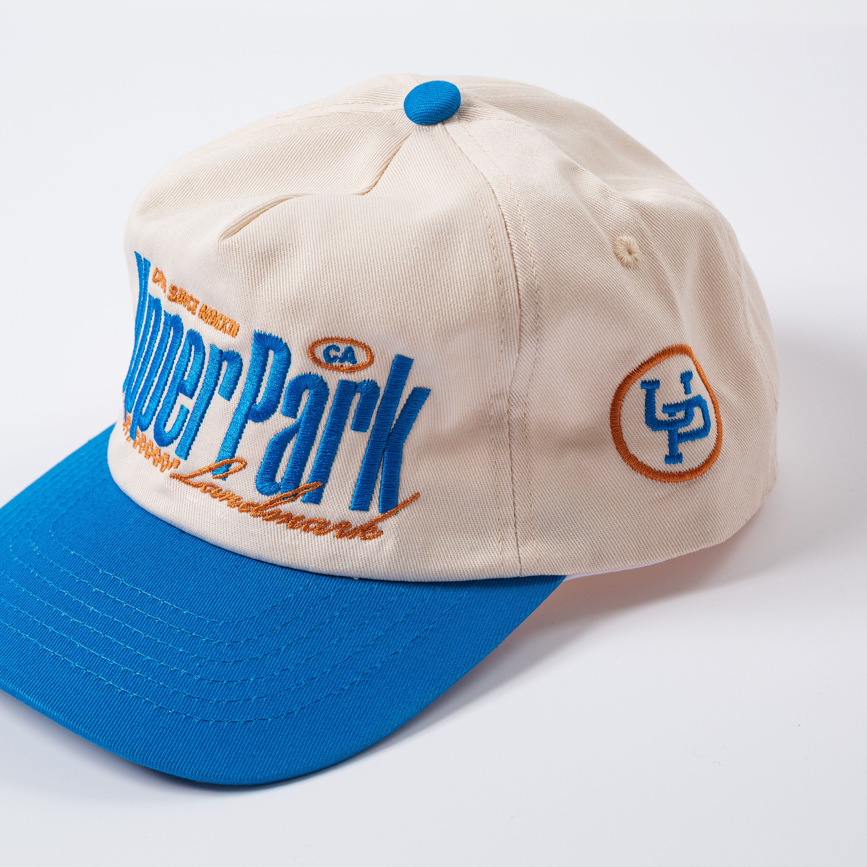 Beige and blue cap with 'Upper Park' branding on a white background - Rally Unstructured Vintage Style Hat