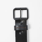 black leather belt with black metal belt buckle on a white background - UPR PRK etched into the leather - Upper Park Basic Leather Belt