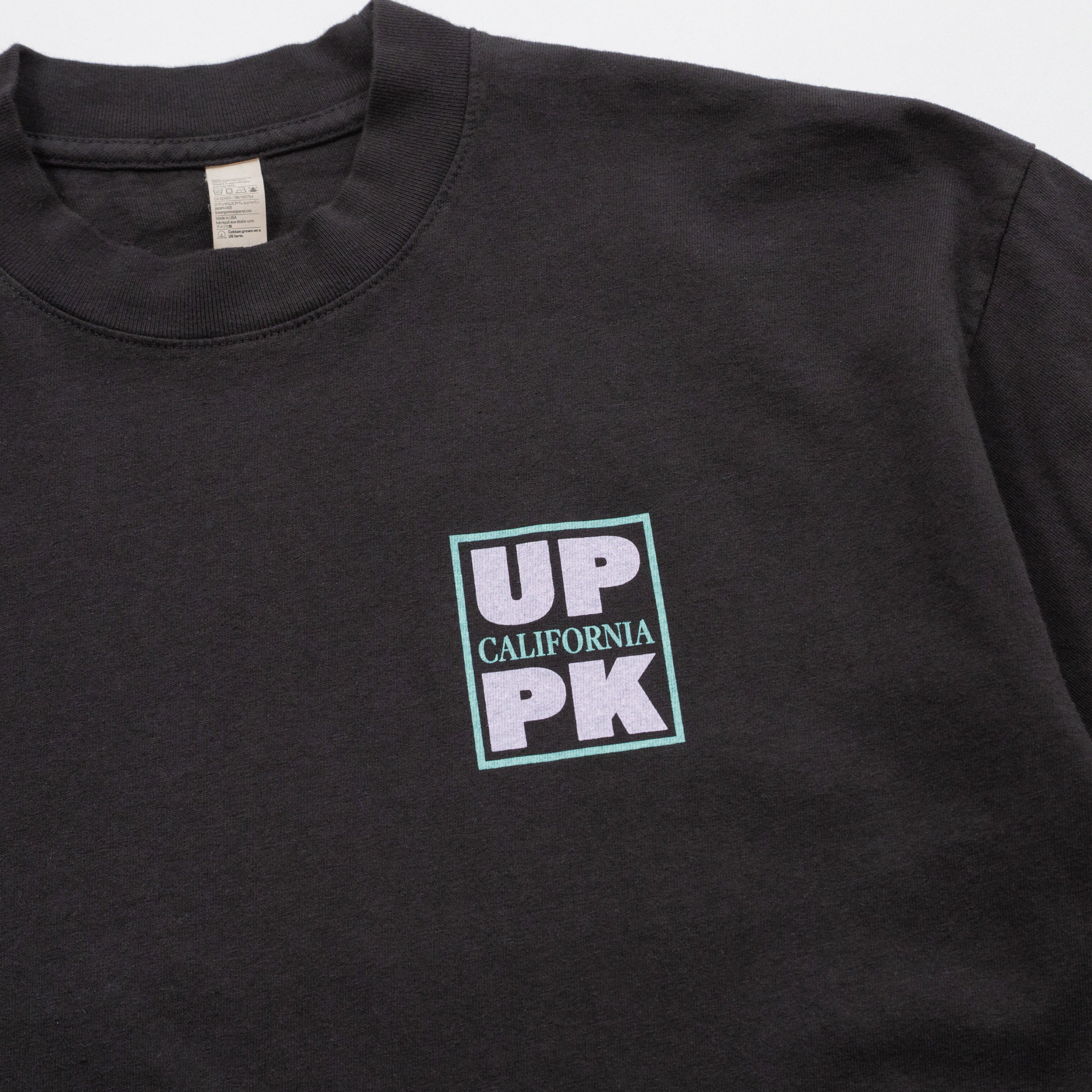Black t-shirt with 'UP CALIFORNIA PK' logo on a plain background
