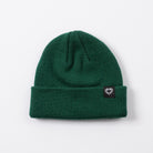 Green beanie with a small logo on a light gray background