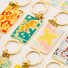 Collection of zodiac keychains on a light background - Detail of Taurus, Gemini, Scorpio